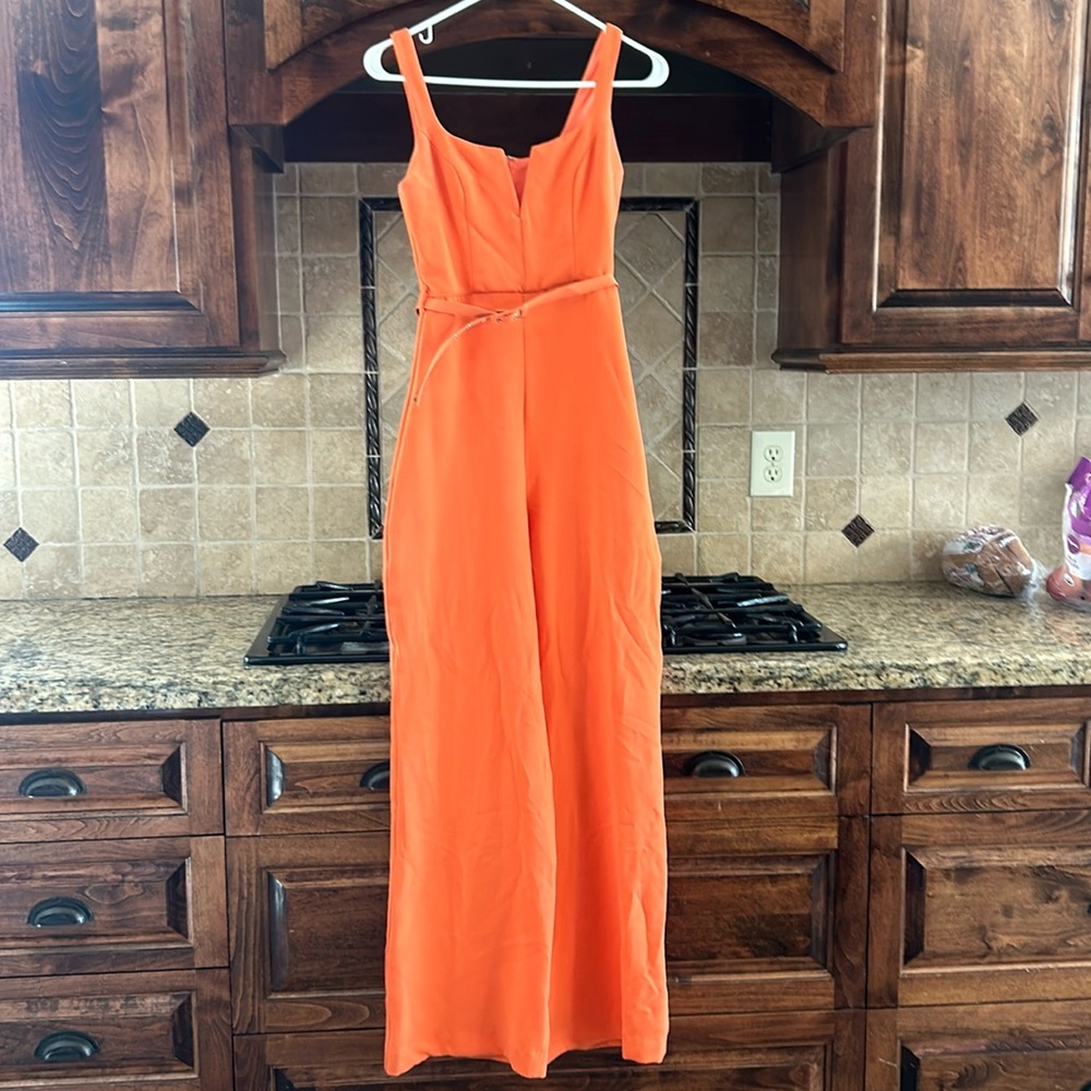 Bright orange 70’s jumpsuit. brand-ASOS Design. size 4. removable belt.